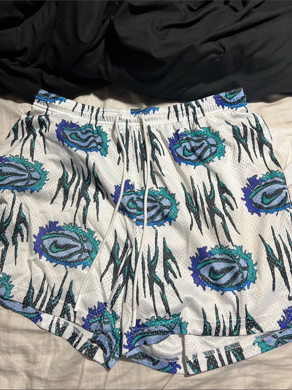 Nike White Athletic Shorts with Teal & Blue Graphic